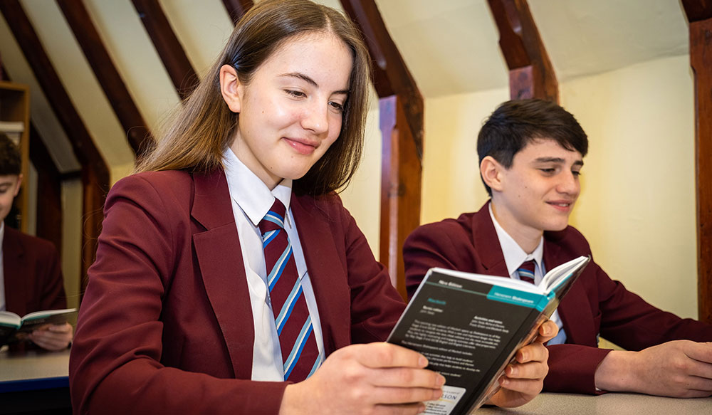 Two Stafford Grammar pupils reading a book during an English lesson